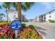 A view of the Fourth Bayshore community showing beautiful landscaping and white buildings under a bright blue sky at 2113 Canal Dr # B2, Bradenton, FL 34207