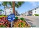 Condominium complex with mature landscaping and plentiful parking on a bright, sunny day at 2113 Canal Dr # B2, Bradenton, FL 34207