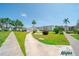 Beautifully landscaped community with sidewalks, fountain, and lush greenery at 2113 Canal Dr # B2, Bradenton, FL 34207