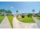 Well-maintained grounds featuring a water fountain, lush lawns, and tropical landscaping at 2113 Canal Dr # B2, Bradenton, FL 34207
