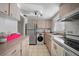 The kitchen has stainless steel appliances and light wood cabinets and includes a washer/dryer combo unit at 2113 Canal Dr # B2, Bradenton, FL 34207
