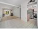 A spacious living room with tile floors and lots of natural light coming through the sliding glass doors at 2113 Canal Dr # B2, Bradenton, FL 34207