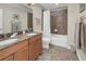 Bathroom featuring a double sink vanity, granite countertop, tiled floor, and a shower-tub combination at 236 Valencia Cir, St Petersburg, FL 33716