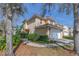 Inviting two-story condo with a terracotta tile roof, neutral stucco and manicured landscaping at 236 Valencia Cir, St Petersburg, FL 33716