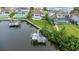 Aerial view of a waterfront home with a private dock and boat, nestled in a beautiful residential community at 4054 Rocky Shores Dr, Tampa, FL 33634