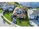 An aerial view displays a beautiful home with lush landscaping, a paved driveway, and a well-maintained lawn at 4054 Rocky Shores Dr, Tampa, FL 33634