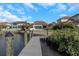 Spacious backyard overlooking the canal, featuring a private dock and lush landscaping for outdoor enjoyment at 4054 Rocky Shores Dr, Tampa, FL 33634