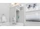 Bathroom features modern faucets, large mirror and framed tropical photography at 4054 Rocky Shores Dr, Tampa, FL 33634