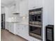 Modern, bright kitchen with stainless steel appliances and marble backsplash at 4054 Rocky Shores Dr, Tampa, FL 33634