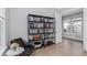 Office space features a built in book case and light-colored wood flooring at 4054 Rocky Shores Dr, Tampa, FL 33634