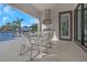 Enjoy outdoor dining with a built-in kitchen and stunning waterfront views from the covered patio at 4054 Rocky Shores Dr, Tampa, FL 33634