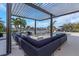 Stunning patio with comfortable seating, a fireplace, and views of the canal and a beautiful swimming pool at 4054 Rocky Shores Dr, Tampa, FL 33634