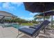 Relaxing pool area with stylish lounge chairs, umbrellas, and a view of the canal at 4054 Rocky Shores Dr, Tampa, FL 33634