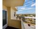 A sunny balcony with building number 611 offers views of the surrounding neighborhood and blue skies at 4650 Cove Cir # 611, St Petersburg, FL 33708