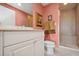 Bathroom showcasing a vanity with cabinet storage, a toilet, and a glass shower enclosure at 501 Mandalay Ave # 601, Clearwater Beach, FL 33767