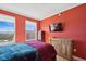 Bedroom featuring a large bed, multiple dressers, and a view of the city skyline at 501 Mandalay Ave # 601, Clearwater Beach, FL 33767
