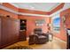 Bedroom area featuring a Murphy bed, leather armchair, and a view of Clearwater Beach at 501 Mandalay Ave # 601, Clearwater Beach, FL 33767