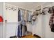 Walk-in closet with custom shelving and hanging racks for optimal organization and storage at 501 Mandalay Ave # 601, Clearwater Beach, FL 33767