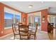 Dining area with floor to ceiling windows showing city views and balcony access at 501 Mandalay Ave # 601, Clearwater Beach, FL 33767