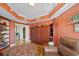 Inviting living room with hardwood floors, built-in bookshelves, and a stylish murphy bed at 501 Mandalay Ave # 601, Clearwater Beach, FL 33767