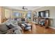 Sun-drenched living room with beautiful bamboo floors, city views and stylish furnishings provides an inviting atmosphere at 501 Mandalay Ave # 601, Clearwater Beach, FL 33767