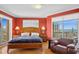 Main bedroom featuring a large window with ocean views, and wooden furnishings at 501 Mandalay Ave # 601, Clearwater Beach, FL 33767