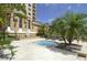Community spa with lounge chairs, palms, and views of the bay at 501 Mandalay Ave # 601, Clearwater Beach, FL 33767