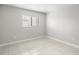 Bedroom with large window and tile floors at 5618 Baywater Dr # 5618, Tampa, FL 33615