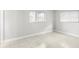 Bright bedroom featuring tiled floors and natural light from a window at 5618 Baywater Dr # 5618, Tampa, FL 33615