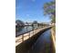 Waterfront community features a wooden dock along the canal with boat parking, waterway views, and lush landscaping at 5618 Baywater Dr # 5618, Tampa, FL 33615