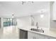 Open-concept space with tiled floors and sliding doors, blending indoor and outdoor living at 5618 Baywater Dr # 5618, Tampa, FL 33615