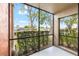 Screened in patio overlooking lush trees and waterway with serene views at 5618 Baywater Dr # 5618, Tampa, FL 33615