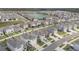 Aerial view of a neighborhood with houses surrounding a pond at 5640 Wandering Willow Dr, Wesley Chapel, FL 33545