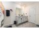 Bathroom featuring double vanity sinks and modern fixtures, offering a blend of functionality and contemporary design at 5640 Wandering Willow Dr, Wesley Chapel, FL 33545