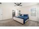 Tranquil bedroom with natural light, a ceiling fan, and neutral tones offers a serene and relaxing retreat at 5640 Wandering Willow Dr, Wesley Chapel, FL 33545