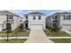 Well-maintained two-story home featuring a two-car garage and manicured landscaping at 5640 Wandering Willow Dr, Wesley Chapel, FL 33545