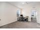Efficient home office space with a desk, chair, and natural light provides an ideal work-from-home environment at 5640 Wandering Willow Dr, Wesley Chapel, FL 33545
