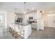 Bright, modern kitchen with white cabinets, stainless steel appliances, and granite countertops at 5640 Wandering Willow Dr, Wesley Chapel, FL 33545