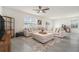 Spacious living room with tile flooring, recessed lighting, and a large sectional sofa at 5640 Wandering Willow Dr, Wesley Chapel, FL 33545