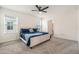 Comfortable bedroom with neutral tones, plush carpeting, and bright natural light at 5640 Wandering Willow Dr, Wesley Chapel, FL 33545