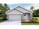 Charming single-Gathering home with a two-car garage and stone accents, surrounded by lush landscaping and mature trees at 6931 Broad River Ave, Land O Lakes, FL 34638