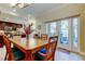 Dining room with access to an outdoor patio and views of the backyard at 757 Date Palm Lane, St Petersburg, FL 33707