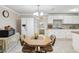 Cozy dining area with charming furnishings adjacent to the kitchen, featuring a chandelier at 7806 Providence Rd, Riverview, FL 33578