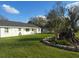 Well-kept lawn complements this charming home's exterior at 7806 Providence Rd, Riverview, FL 33578