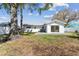 Large backyard featuring a patio with a hot tub, perfect for outdoor relaxation at 8704 Thornwood Ln, Tampa, FL 33615