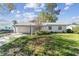 Charming single-story home with a well-manicured lawn and a cozy curb appeal at 8704 Thornwood Ln, Tampa, FL 33615