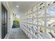 Covered walkway featuring geometric breeze blocks on a light colored home at 8704 Thornwood Ln, Tampa, FL 33615