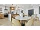 Spacious kitchen and dining area featuring a marble-topped table and modern finishes at 8704 Thornwood Ln, Tampa, FL 33615