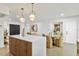 Kitchen with large island and seating that overlooks an adjacent sitting area at 8704 Thornwood Ln, Tampa, FL 33615