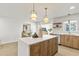 Kitchen area with island and seating overlooking the dining area at 8704 Thornwood Ln, Tampa, FL 33615